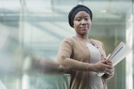 Businesswoman holding folder in office