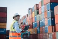 Male engineer working at containers yard