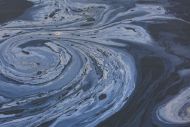 The view from above of a layer of oil, a slick on the waters