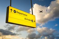 an airport sign showing arrivals and departures