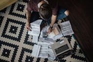 Person looking through bills