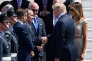  Secretary of State for International Trade Liam Fox (L) greets U.S. President Donald Trump following the President's arrival at Stansted Airport on July 12, 2018 in Essex, England