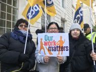 PCS picket line with 'Our Work Matters' campaign placard
