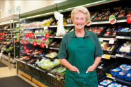 Image of mature female shop worker