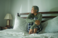Sick woman on bed