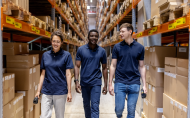 young workers walking through warehouse