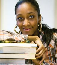 Woman with a stack of books