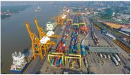 Cargo ship with aerial view of port