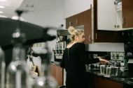 Woman making coffee in a kitchen