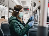 Woman with mask on bus