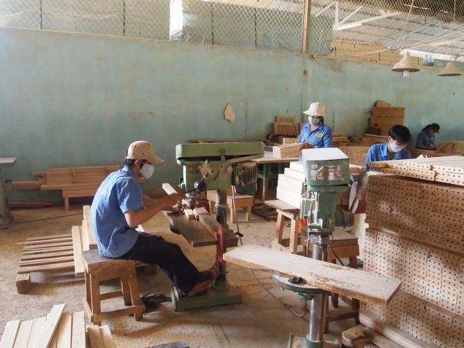 Workers in a wood furniture factory in Vietnam